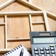 home planning with notebook and calculator - South Metro Custom Remodeling custom basement remodel