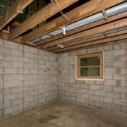 unfinished basement with window - South Metro Custom Remodeling full basement remodel