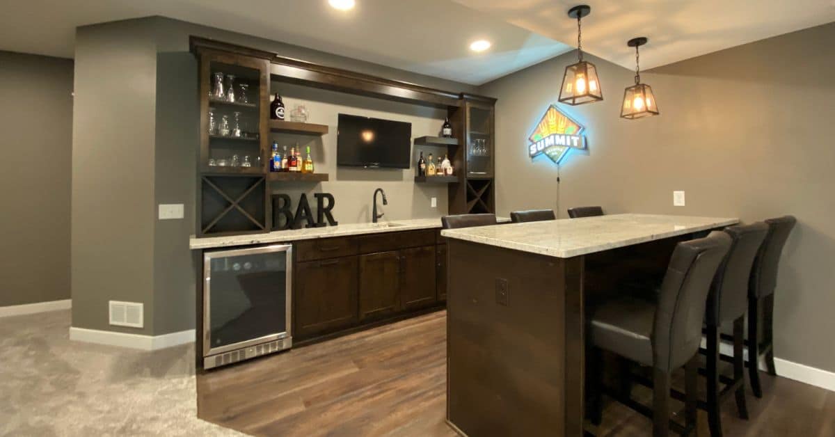 finished basement with a wet bar and mini fridge - South Metro Custom Remodeling basement contractor Eden Prairie MN
