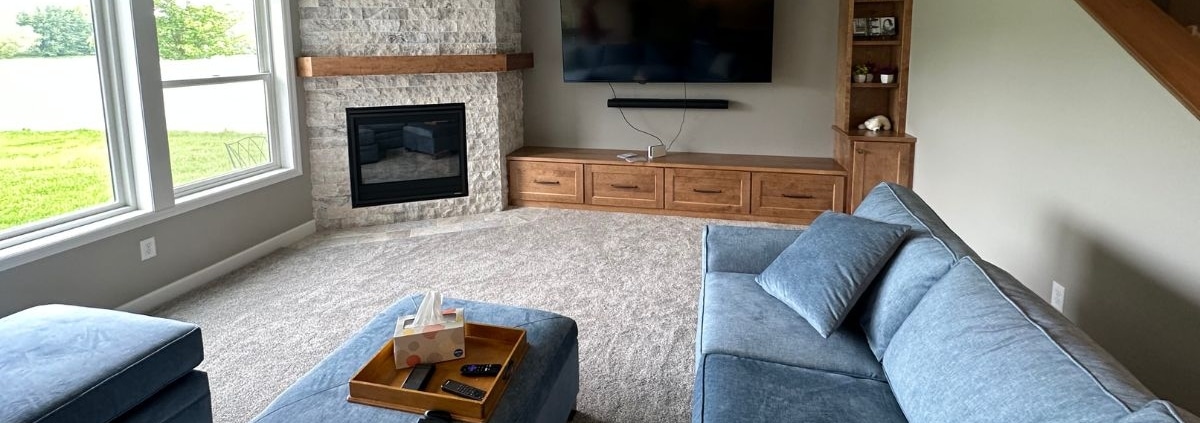 finished basement with blue couch - South Metro Custom Remodeling basement contractor Lakeville MN