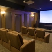 custom home theater with brown seats - South Metro Custom Remodeling basement remodeling ideas