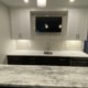 finished basement with a full kitchen with stone countertops - South Metro Custom Remodeling basement contractor