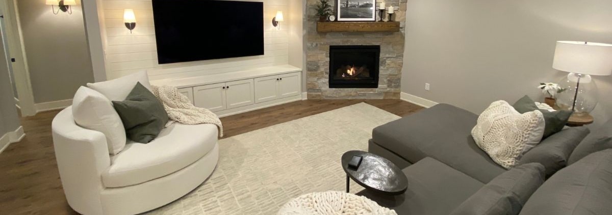 finished basement with a stone fireplace - South Metro Custom Remodeling basement remodeling ideas
