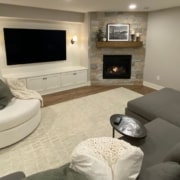 finished basement with a stone fireplace - South Metro Custom Remodeling basement remodeling ideas