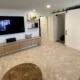 finished basement with custom cabinetry and wall mounted TV - South Metro Custom Remodeling custom basement remodeling