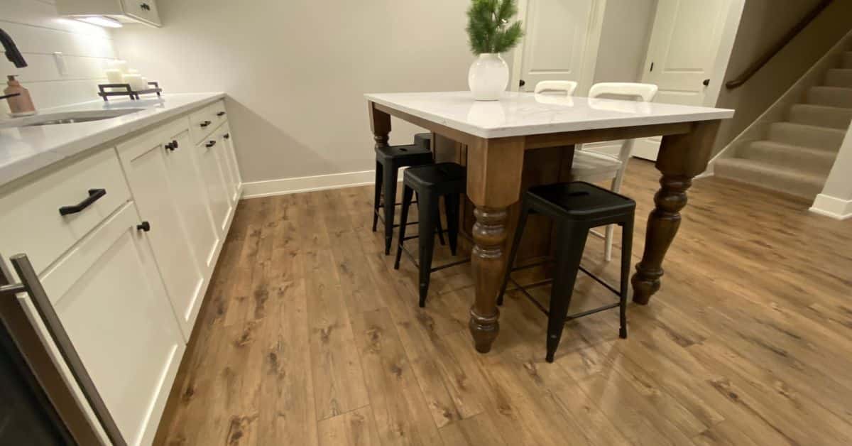 finished basement with a dining table and light wood floors - South Metro Custom Remodeling custom basement remodeling