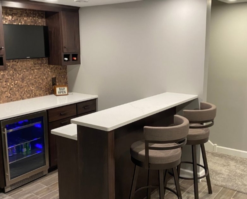 finished basement with wet bar and island - South Metro Custom Remodeling custom basement remodeling