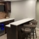 finished basement with wet bar and island - South Metro Custom Remodeling custom basement remodeling