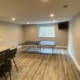 finished basement with ping pong table and large window - South Metro Custom Remodeling custom basement remodel