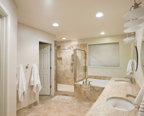 A basement bathroom remodel in Minnesota featuring a modern shower and a stylish bathtub.