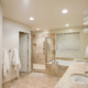 A basement bathroom remodel in Minnesota featuring a modern shower and a stylish bathtub.